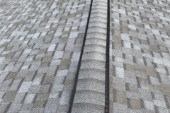 A close-up image of a roof with a new ridge vent.