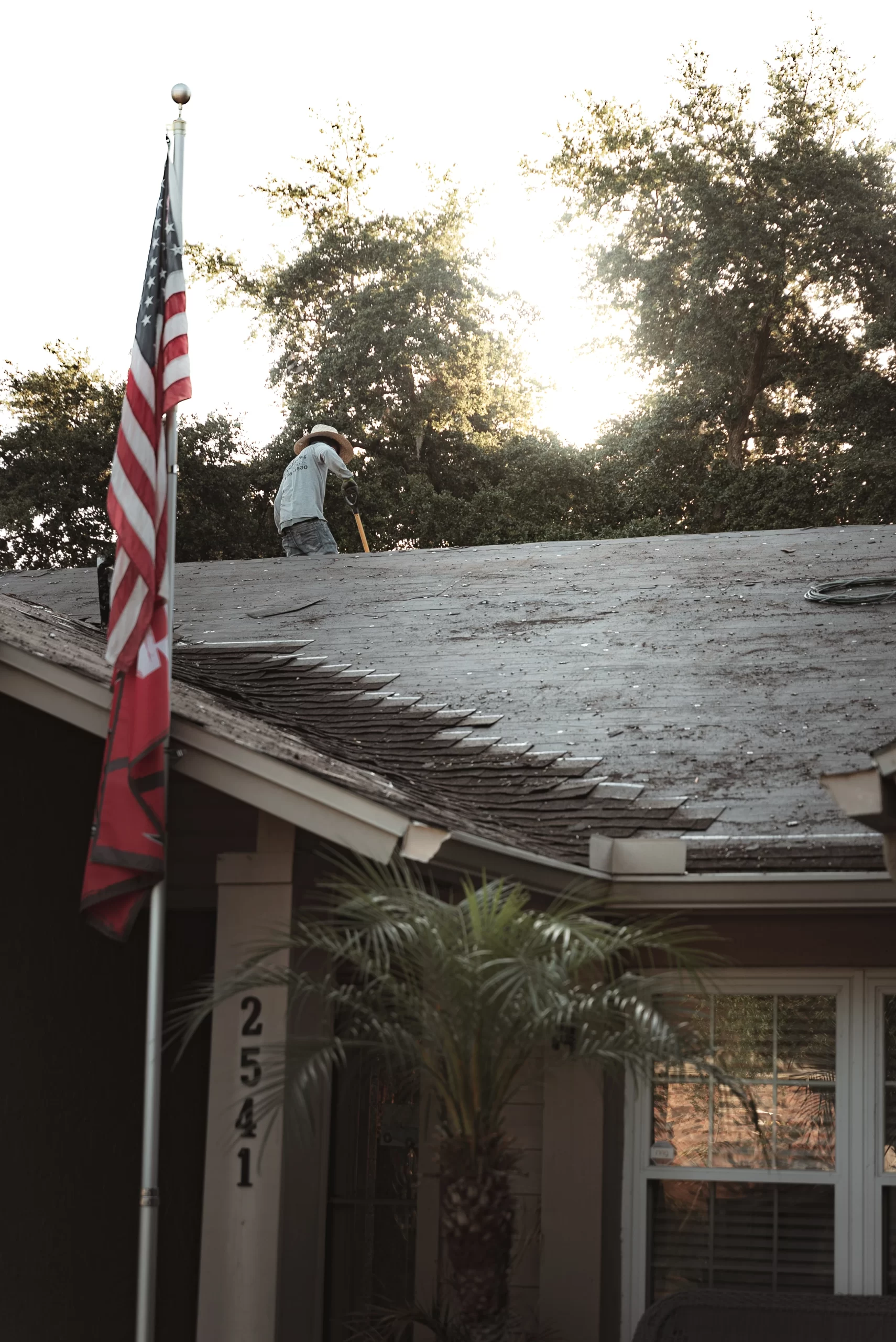 CB Roofing Roofing Contractor on a residential home performing a tear off before installing a new asphalt shingle roof.